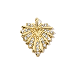 Close-up of golden heart pendant featuring radial lines and sparkling white zircons