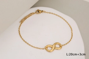 Detail of gold infinity symbol bracelet with adjustable lobster clasp and 20cm chain