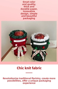 Detailed view of red and green tweed knit gift bags with festive pompoms and Christmas ribbons