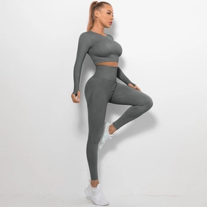 Detail of charcoal grey seamless yoga set with thumbhole sleeves and high waist fitness leggings