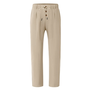 Detail view of khaki cotton linen pants featuring elastic drawstring waist and amber buttons