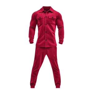 Detail of red faux suede jacket and trousers set with buttons and chest pockets