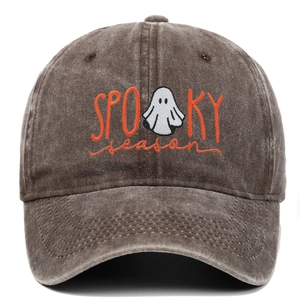 Detail of embroidered Spooky Season text and ghost icon on washed cotton baseball cap