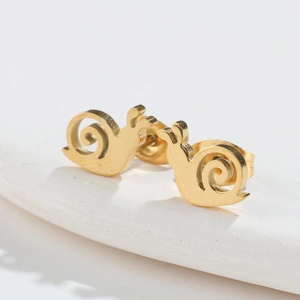 Macro shot of minimalist gold snail stud earrings in polished stainless steel finish