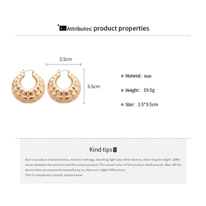 Detail view of golden quilted texture hoop earrings with size and weight specifications