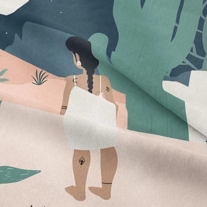 Detailed macro view of woven fabric texture showing a bohemian desert woman illustration
