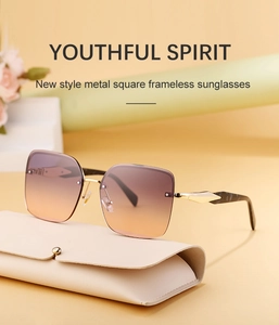 Frameless oversized square sunglasses with gradient lenses and a beige leather case