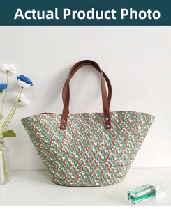 Detail of colorful woven straw tote bag with multi-color wave pattern and leather straps