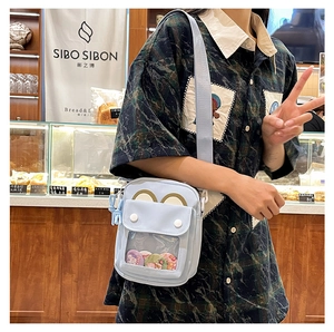 Blue canvas ita bag with a clear window and pins shown in a bakery setting