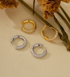 Close-up of S925 sterling silver U-shaped earrings with micro-pave white cubic zirconia