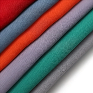 Detailed texture of colorful pearl chiffon fabrics in a variety of vibrant color layers