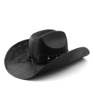 Detail of black woven cowboy hat featuring leather band and metallic brass studs