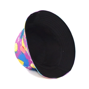 Detail of double-sided bucket hat featuring vibrant lemon print and black lining
