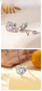 Close-up of pink and blue heart earrings with cubic zirconia and screw-back posts