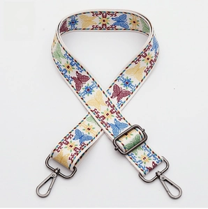 Detail of woven bag strap No. 361 featuring ethnic butterfly patterns and gunmetal clasps
