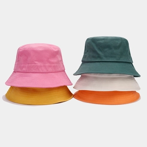 Retro patchwork cotton bucket hats shown in various colors like pink and mustard yellow