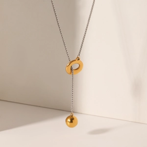 Two-tone stainless steel Y-necklace with gold geometric ring and ball pendant