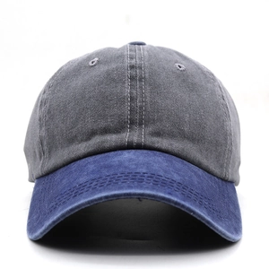 Detail of washed cotton baseball cap with blue brim and grey crown stitching