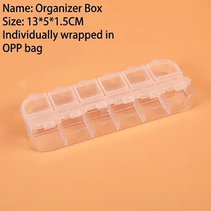 Detailed view of 10-compartment transparent plastic storage box with numbered lids
