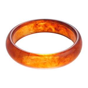 Polished amber resin spiral cuff bracelet with a minimalist glossy metallic texture