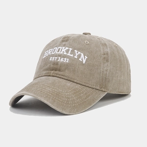 Detail of Brooklyn embroidery on washed cotton baseball cap with vintage texture