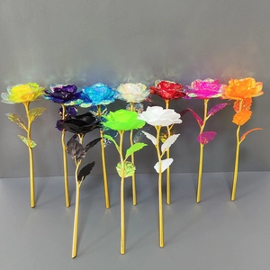 Detailed view of colorful artificial roses with gold leaves in various vibrant metallic colors