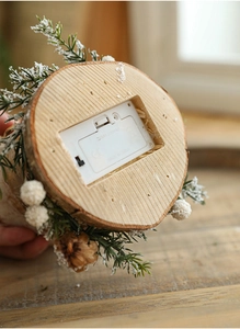 Detail of wooden base on Christmas tree ornament with battery box and toggle switch