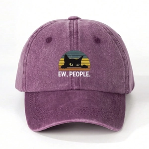 Close-up of purple washed denim baseball cap with black cat and EW PEOPLE print detail