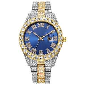 Macro detail of luxury men's iced-out watch with blue dial and roman numerals