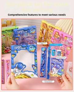 Close-up of kids stationery set with ruler, pencil, eraser and notebook in cute cases