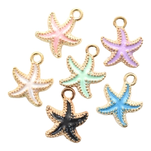 Detailed view of colorful starfish charms in enamel and gold-plated alloy for jewelry DIY