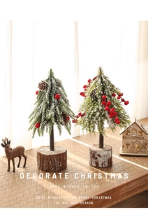 Close-up of 24cm mini Christmas trees with red berries, pine cones and wooden bases
