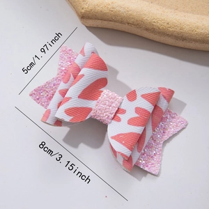 Pink heart bow hair clip detail with dimensions 8cm by 5cm on white surface