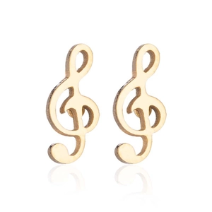 Detail shot of golden treble clef musical note stud earrings with mirror reflection