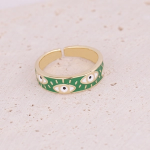 Detail of green enamel evil eye ring with gold metal finish and adjustable open band