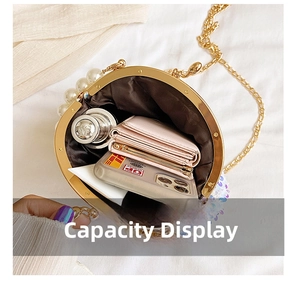 Internal capacity of round gold sequin evening bag showing phone, wallet and lipstick