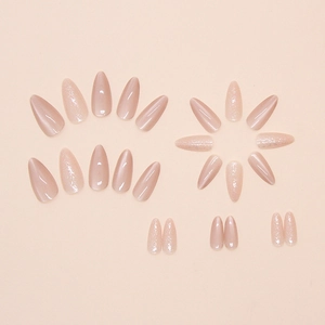 Macro shot of 24pcs nude pink almond press-on nails with glossy and shimmer finish