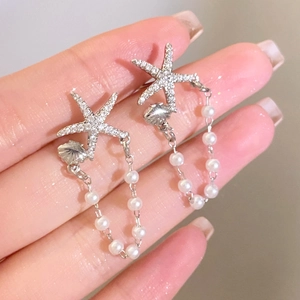 Sparkling rhinestone starfish earrings with elegant pearl tassels in a silver finish