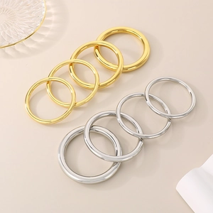 Polished hollow tube stainless steel bangles in gold and silver finish stack