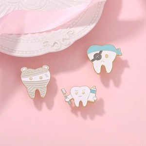 Cute tooth enamel pins set featuring mummy, pirate and dentist themes on pink background