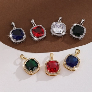 Detail of square zircon pendants in multiple colors with sparkling crystal borders