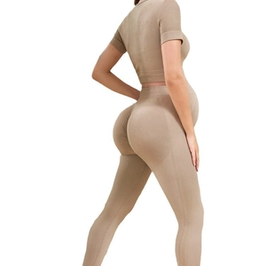 Seamless maternity yoga set with high-waisted leggings and short sleeve top in khaki ribbed fabric