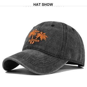Close-up of orange palm tree embroidery and Summer text on washed grey cotton baseball cap