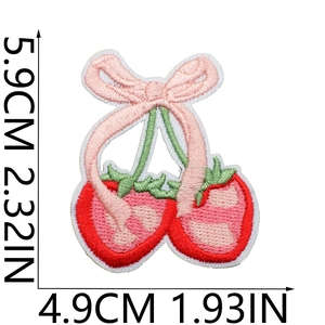 Detailed embroidery patch featuring cherry and strawberry motifs with pink bow decoration