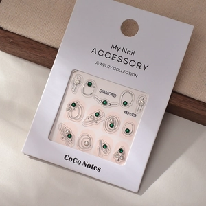 Detail of MJ-029 nail art stickers featuring silver frames and emerald green crystals