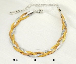 Detail of three-strand braided stainless steel snake chain bracelet with lobster clasp