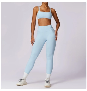 Close-up of light blue seamless yoga set with high waist leggings and thin strap sports bra
