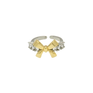 Close-up of dual-tone open ring featuring a golden bow and sparkling round zircons
