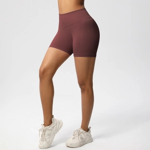 Close-up of high-waist seamless compression sports shorts in burgundy for yoga and fitness