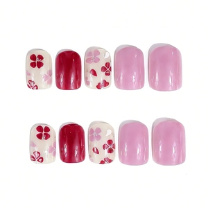 Short square press-on nails set with red and pink floral patterns and glossy finish